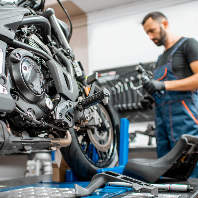 motorcycle-with-worker-at-the-workshop-2021-09-17-17-25-40-utc